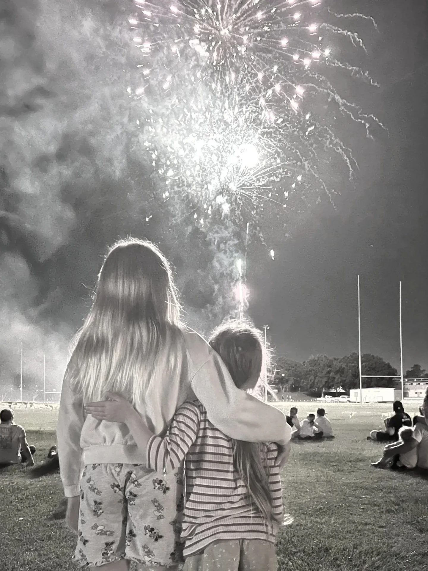 Two young people watching fireworks together